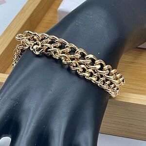 Two gold colored chains approximately 7 and 7.5” long